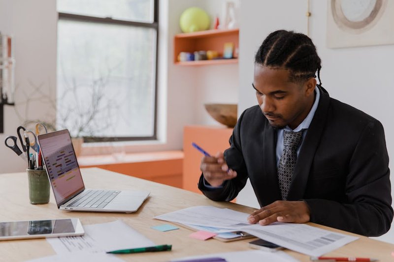 Business owner in South Yarra reviewing an SEO performance dashboard showing Melbourne-local keyword rankings and conversion data